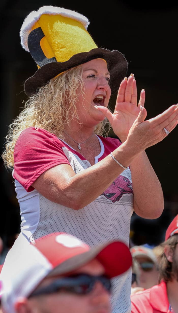A Razorback fan wears a beer hat signifying the bases are loaded during a 17-2 win over Stanford on Saturday afternoon.